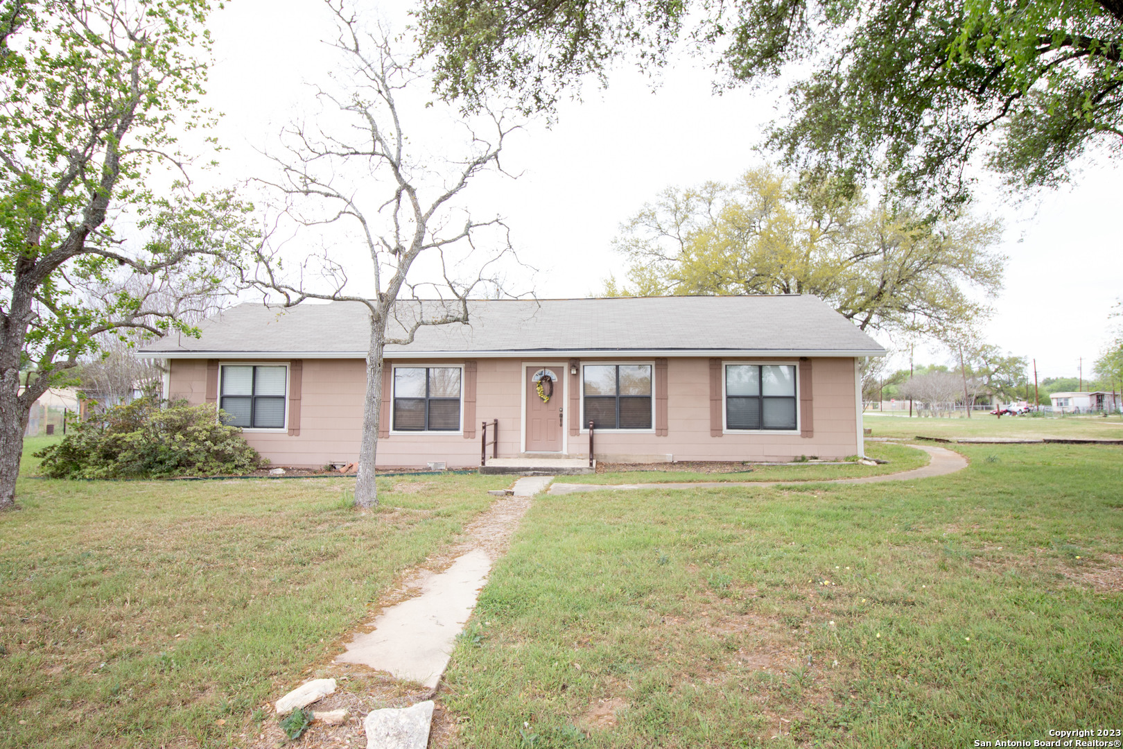 307 5th Street Sutherland Springs, TX 78161 - Photo 1 of 1 a front view of a house with a yard