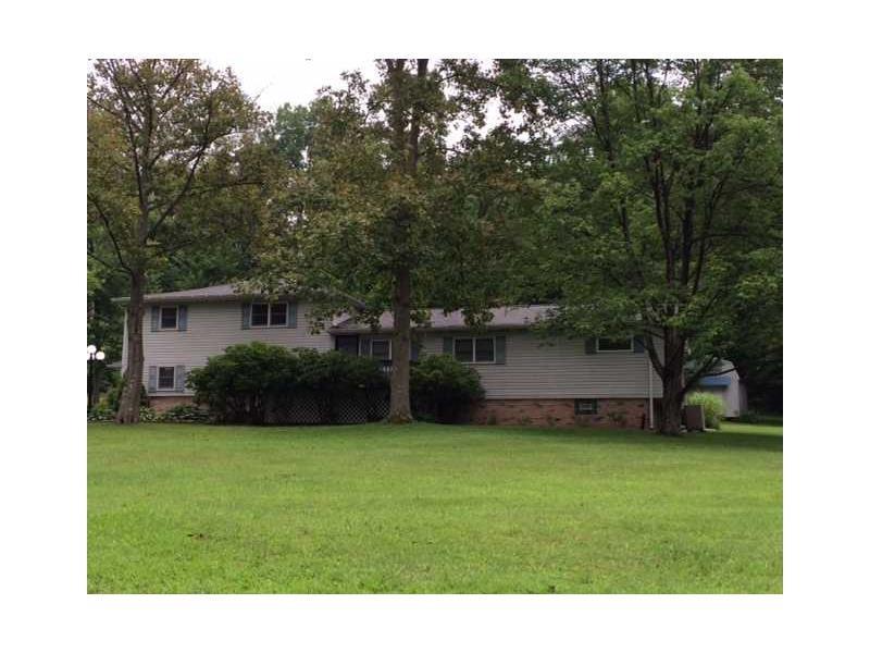730 Banning Road Dawson, PA 15428 - Photo 22 of 25 View of the Front with mature trees in country setting.