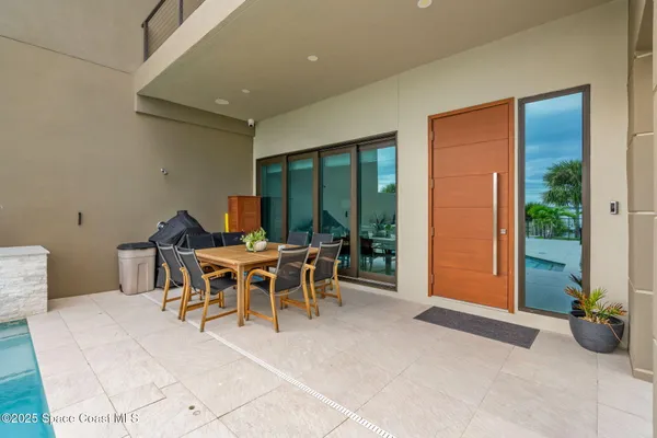 a view of a balcony with wooden floor and outdoor space