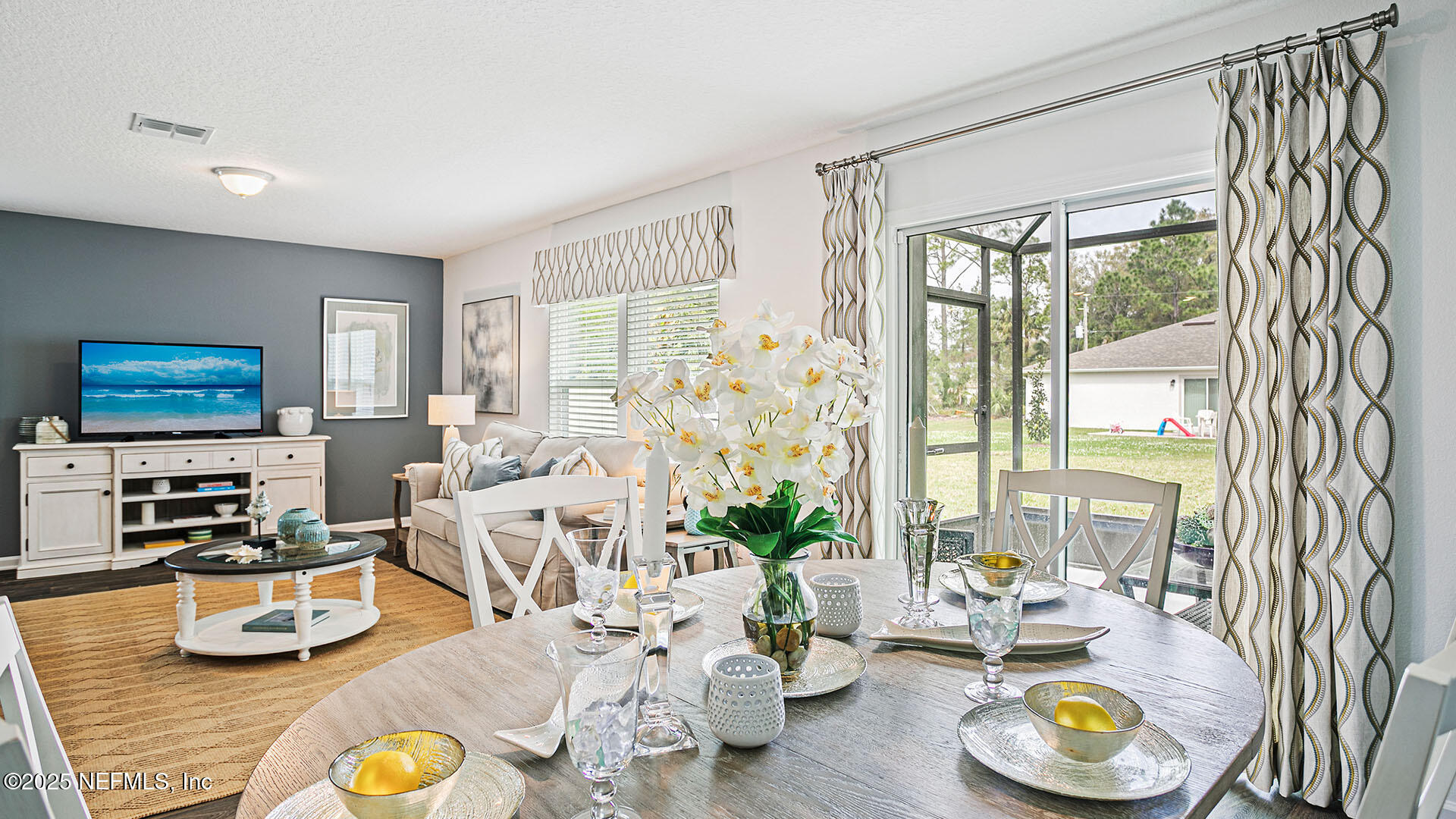 31 Palm Lane Palm Coast, FL 32164 - Photo 11 of 34 a living room with furniture and a flat screen tv