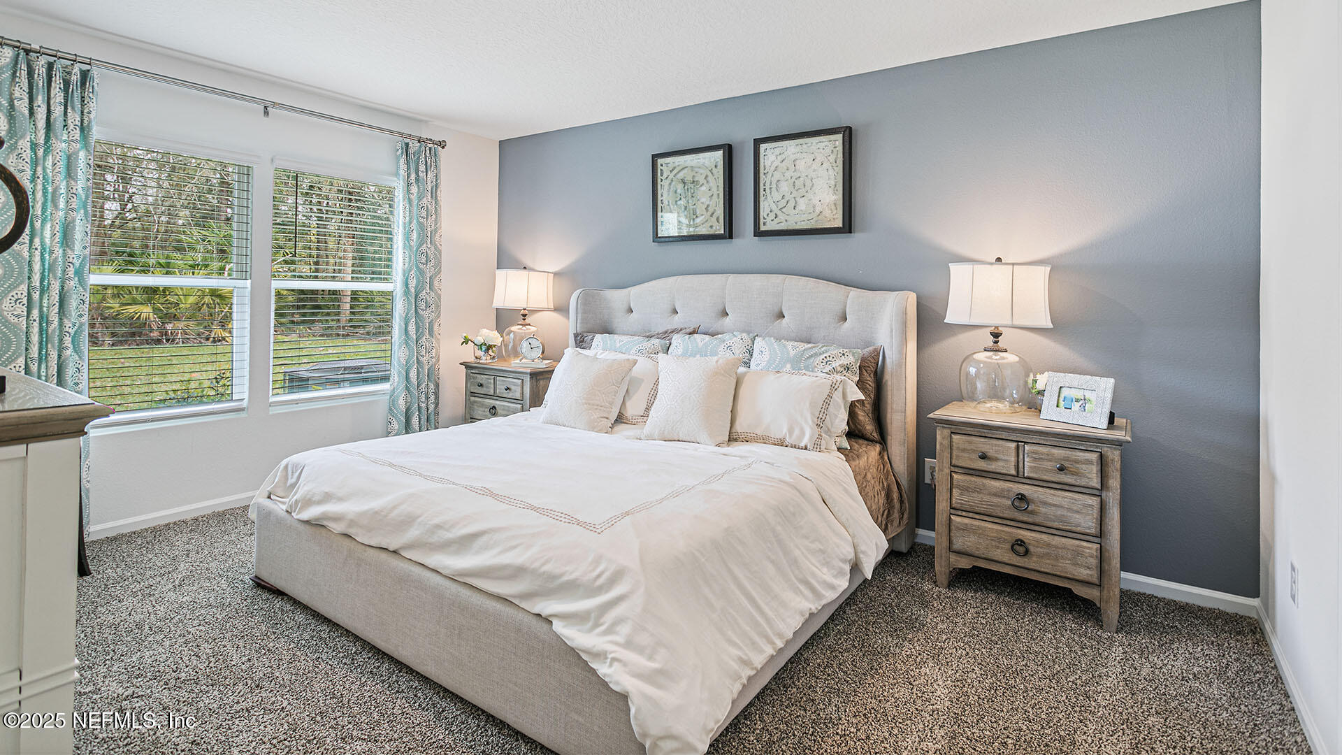 31 Palm Lane Palm Coast, FL 32164 - Photo 12 of 34 a large bed sitting in a bedroom next to a window