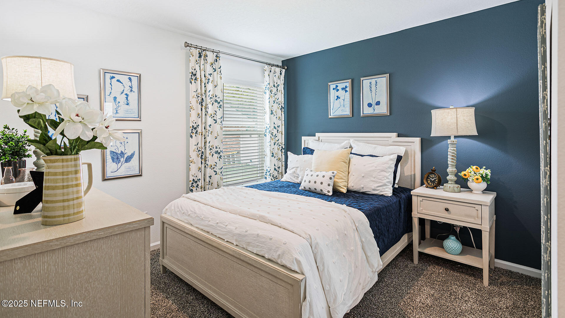 31 Palm Lane Palm Coast, FL 32164 - Photo 18 of 34 a bedroom with a bed and a potted plant