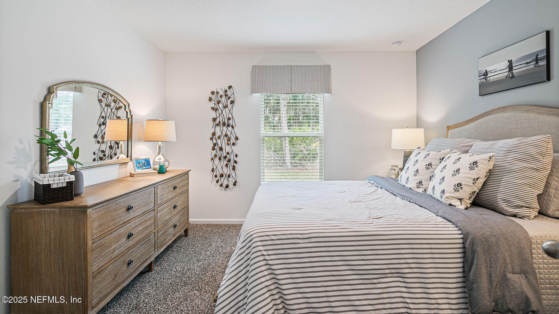 31 Palm Lane Palm Coast, FL 32164 - Photo 21 of 34 a spacious bedroom with a bed and a dresser