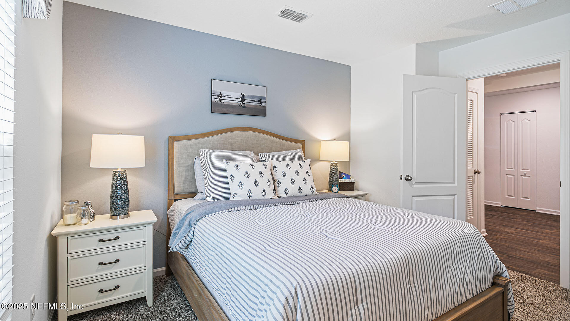 31 Palm Lane Palm Coast, FL 32164 - Photo 22 of 34 a bedroom with a bed and a night stand