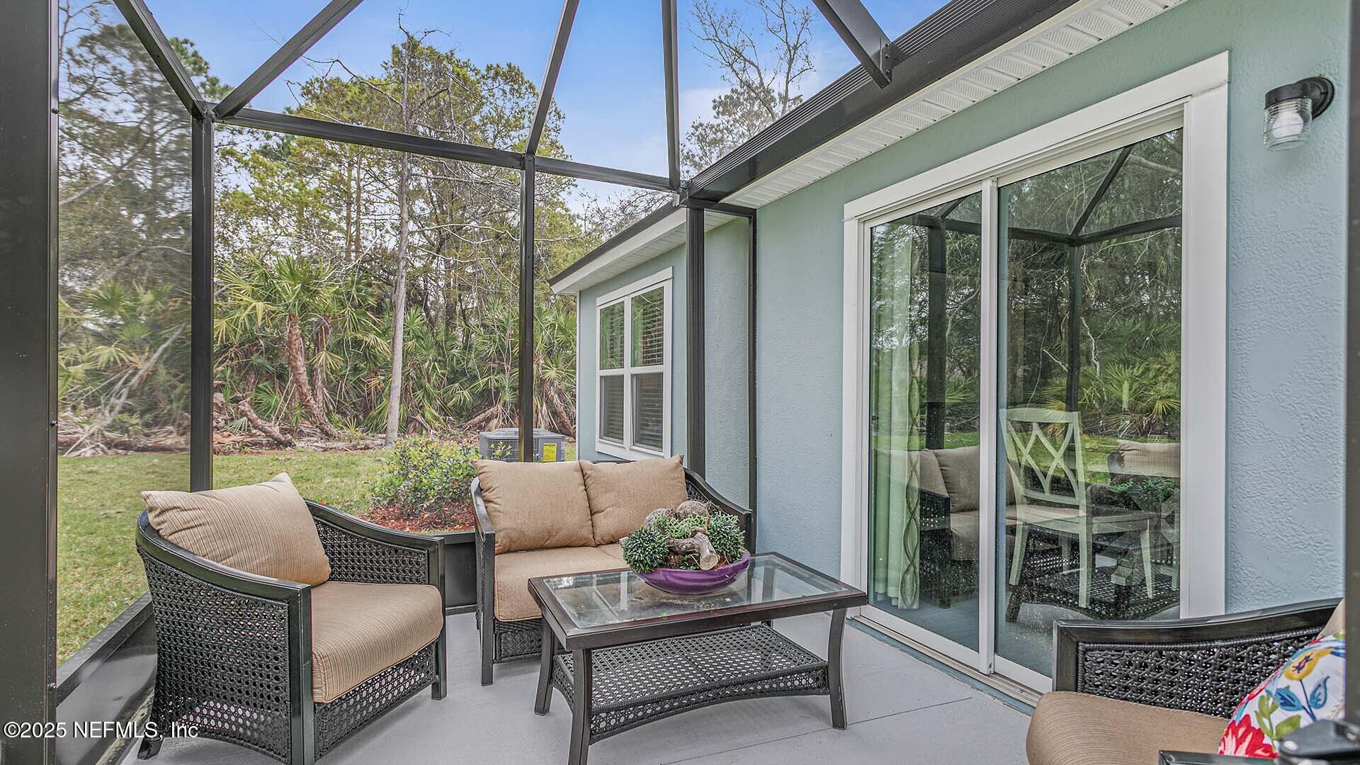 31 Palm Lane Palm Coast, FL 32164 - Photo 24 of 34 a outdoor living space with furniture and garden view