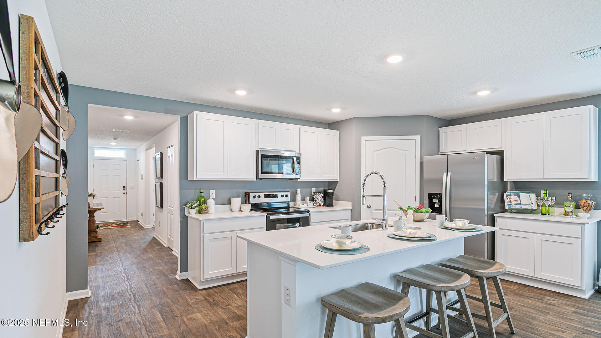 31 Palm Lane Palm Coast, FL 32164 - Photo 5 of 34 a kitchen with a sink a stove and chairs