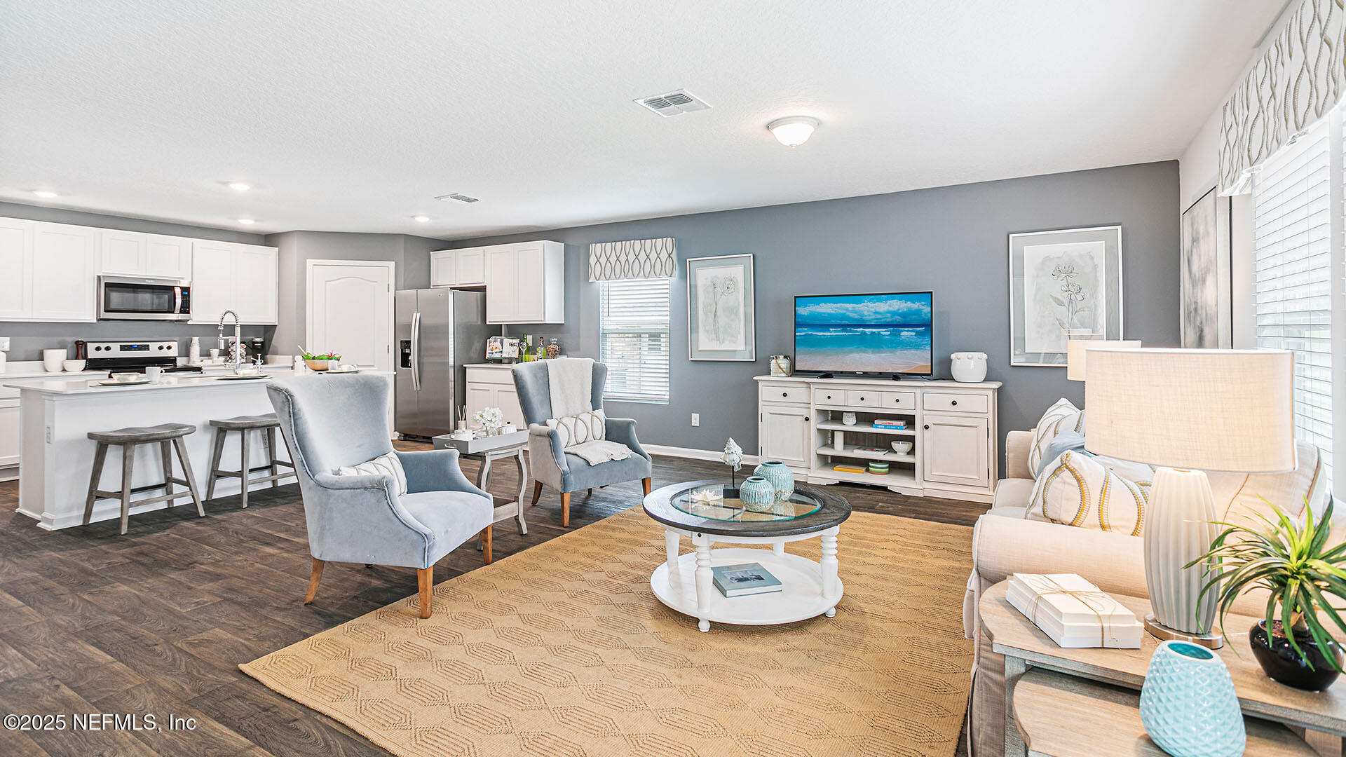 31 Palm Lane Palm Coast, FL 32164 - Photo 9 of 34 a living room with furniture and a kitchen