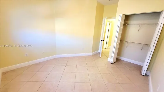 a view of an empty room with a fireplace