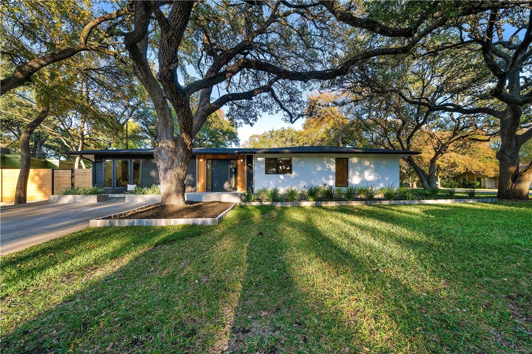 8900 Point W Drive Austin, TX 78759 - Photo 1 of 1 a view of a house with a yard patio and a large tree