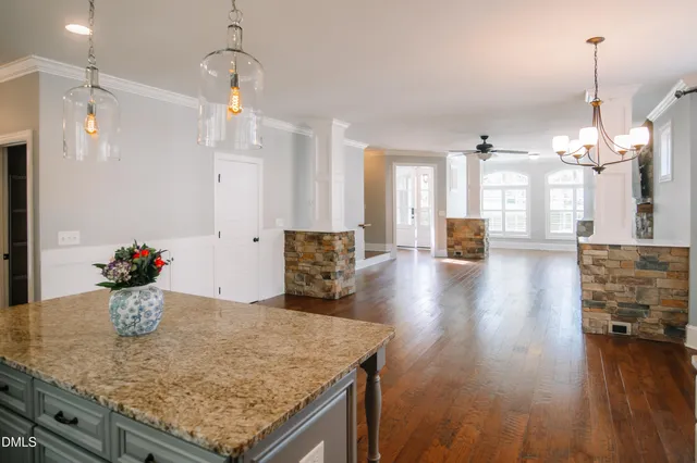 a view of a kitchen and dining table
