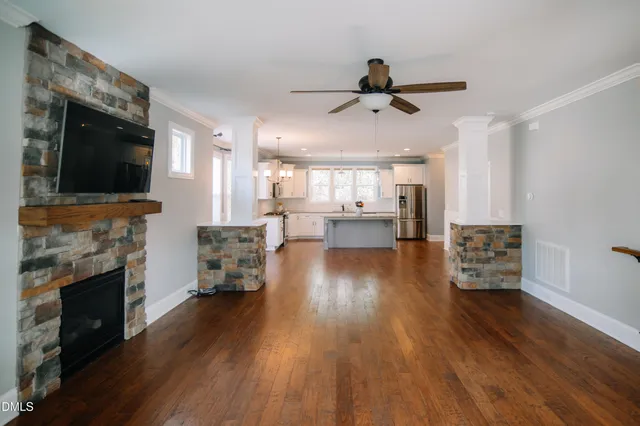 a living room with furniture and a fireplace