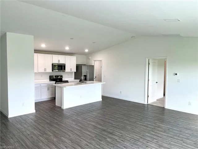 a view of kitchen with wooden floor