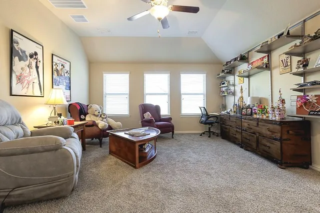 a living room with furniture and a window