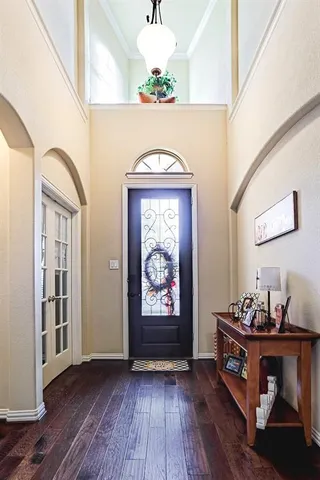 a view of entryway with wooden floor