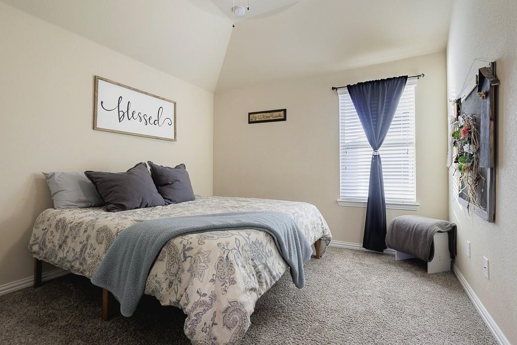 4505 Evenstar Way Plano, TX 75074 - Photo 21 of 29 Carpeted bedroom featuring baseboards and vaulted ceiling