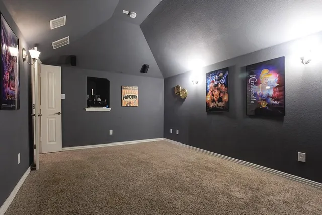 a view of a livingroom with an empty space and a window