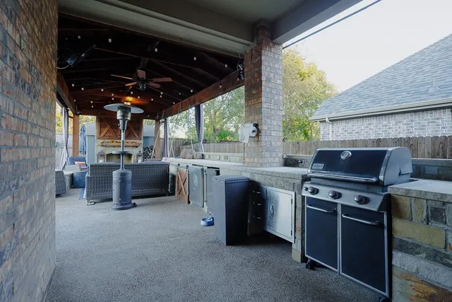 a view of kitchen with sink and chairs