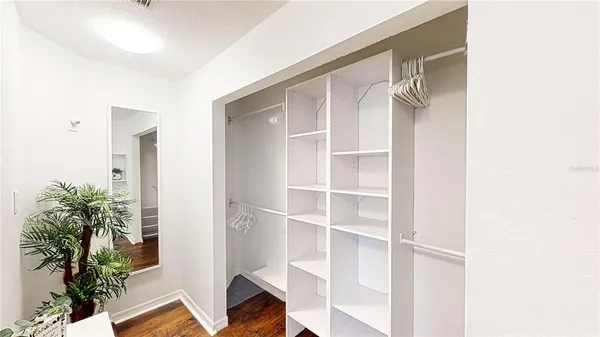 a view of closet area with potted plants