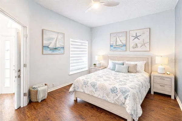 a bedroom with a large bed and a window