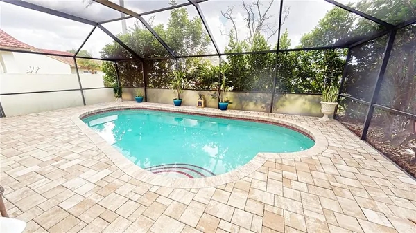 a view of a swimming pool with a patio