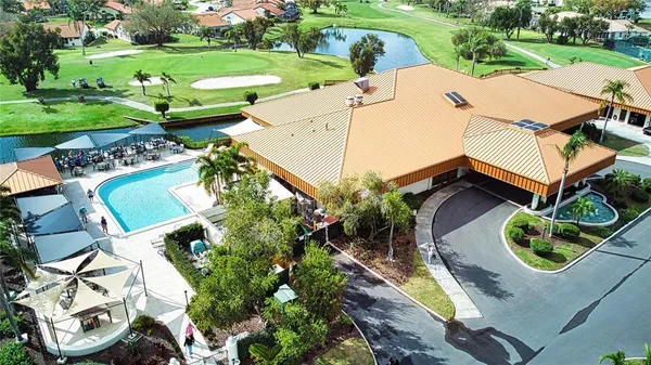 an aerial view of a house with garden space and street view