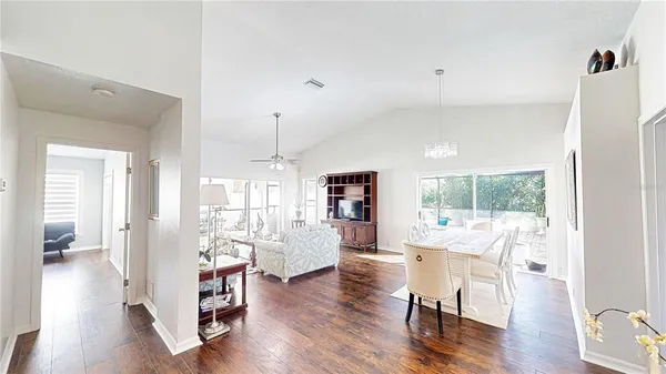 a view of a dining room with furniture window and wooden floor