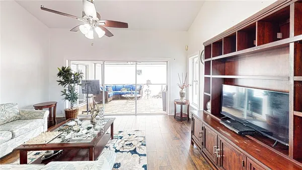 a living room with furniture fireplace and a flat screen tv