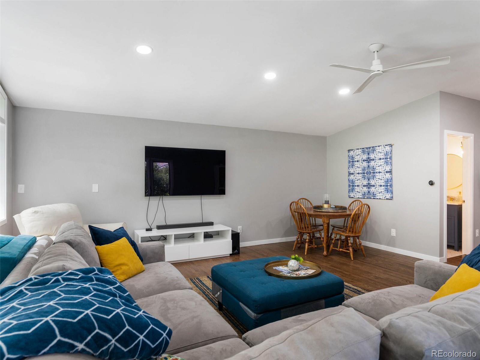 1826 Smith Road Golden, CO 80401 - Photo 15 of 35 a living room with furniture and a flat screen tv