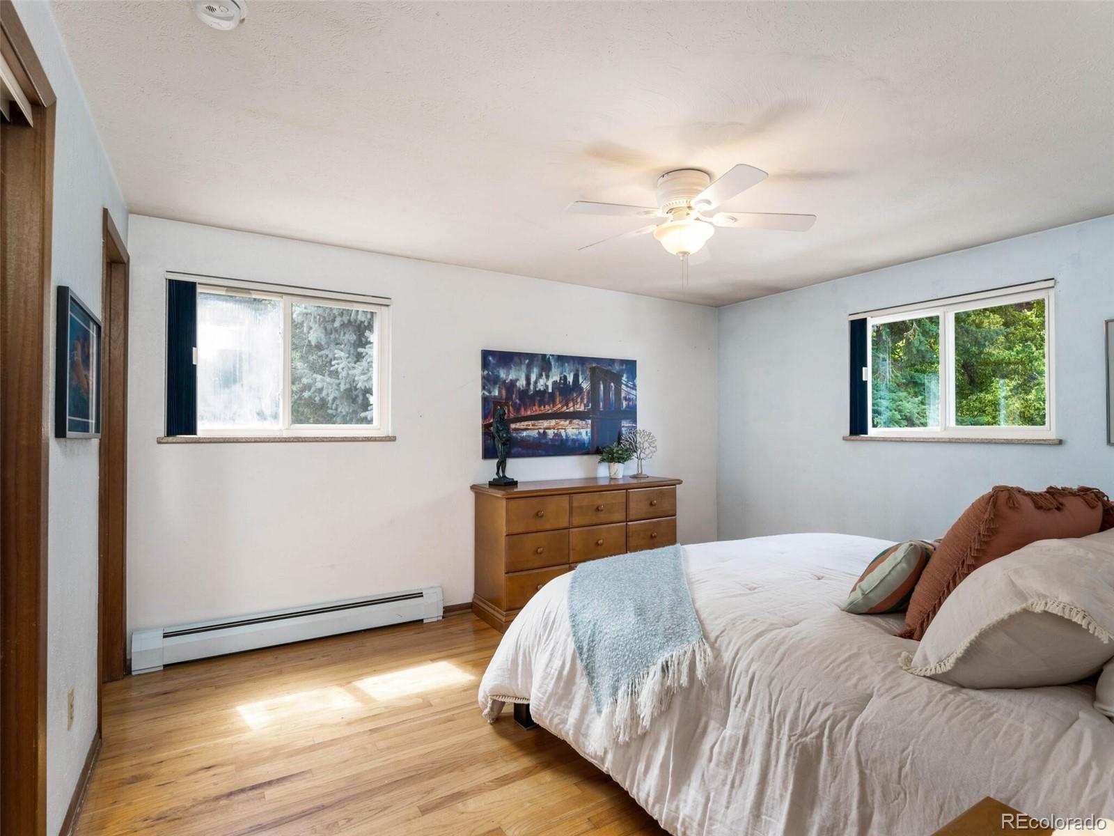 1826 Smith Road Golden, CO 80401 - Photo 18 of 35 a bedroom with a bed and a window