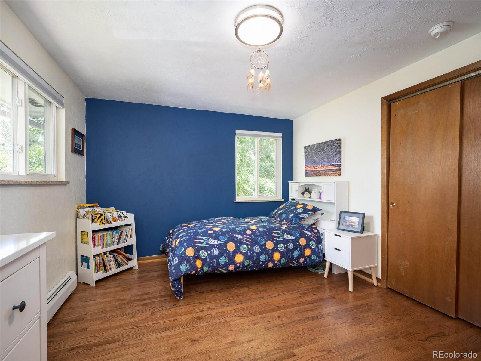 1826 Smith Road Golden, CO 80401 - Photo 22 of 35 a bedroom with a bed and a window