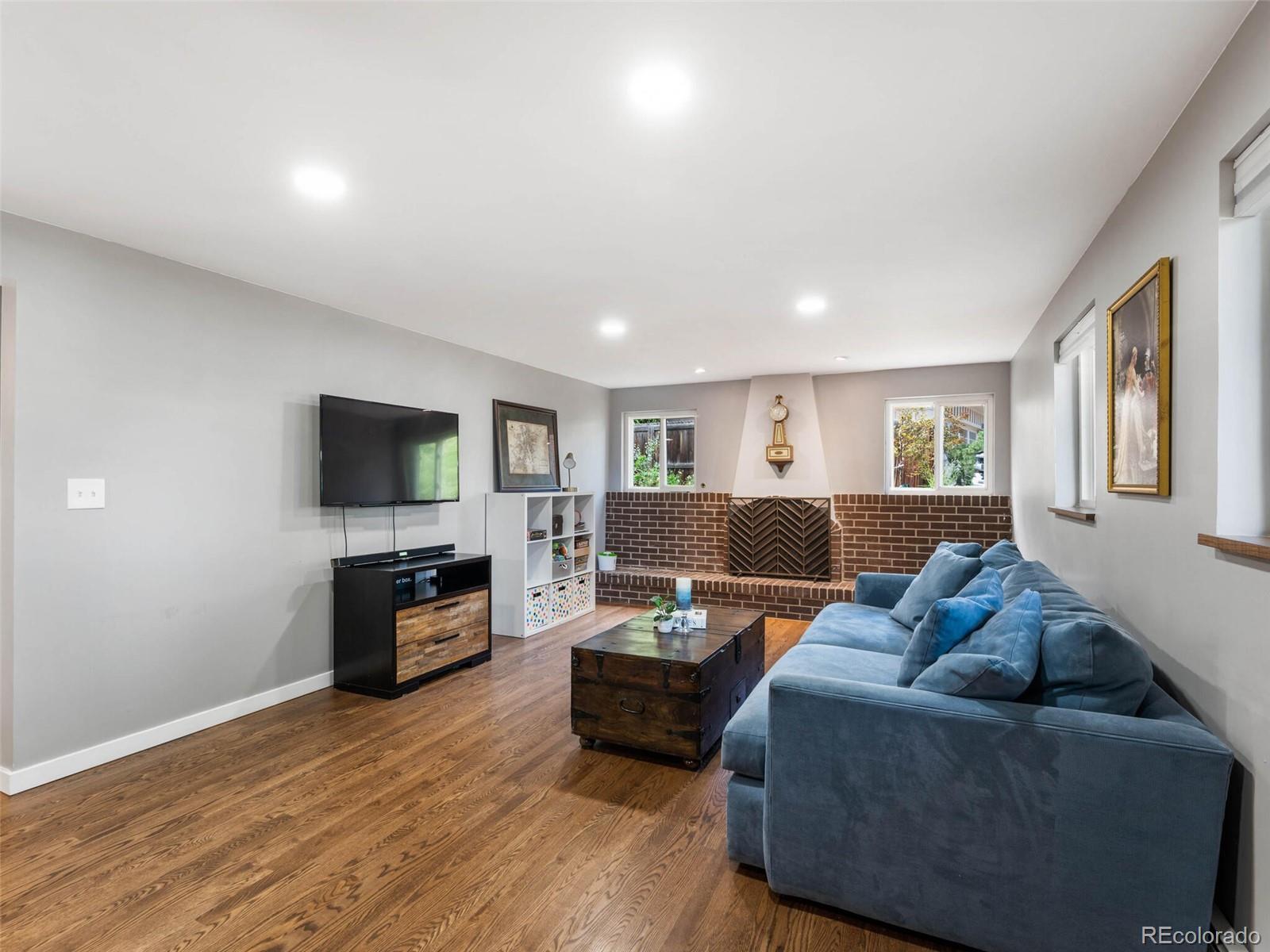 1826 Smith Road Golden, CO 80401 - Photo 26 of 35 a living room with furniture and a flat screen tv