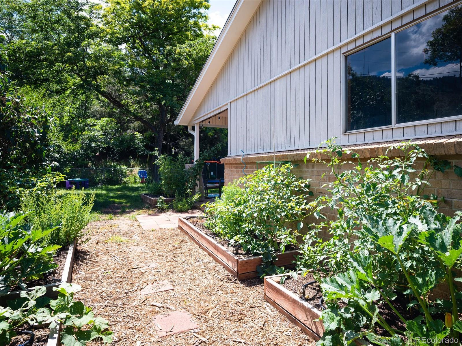 1826 Smith Road Golden, CO 80401 - Photo 34 of 35 a view of a backyard with potted plants