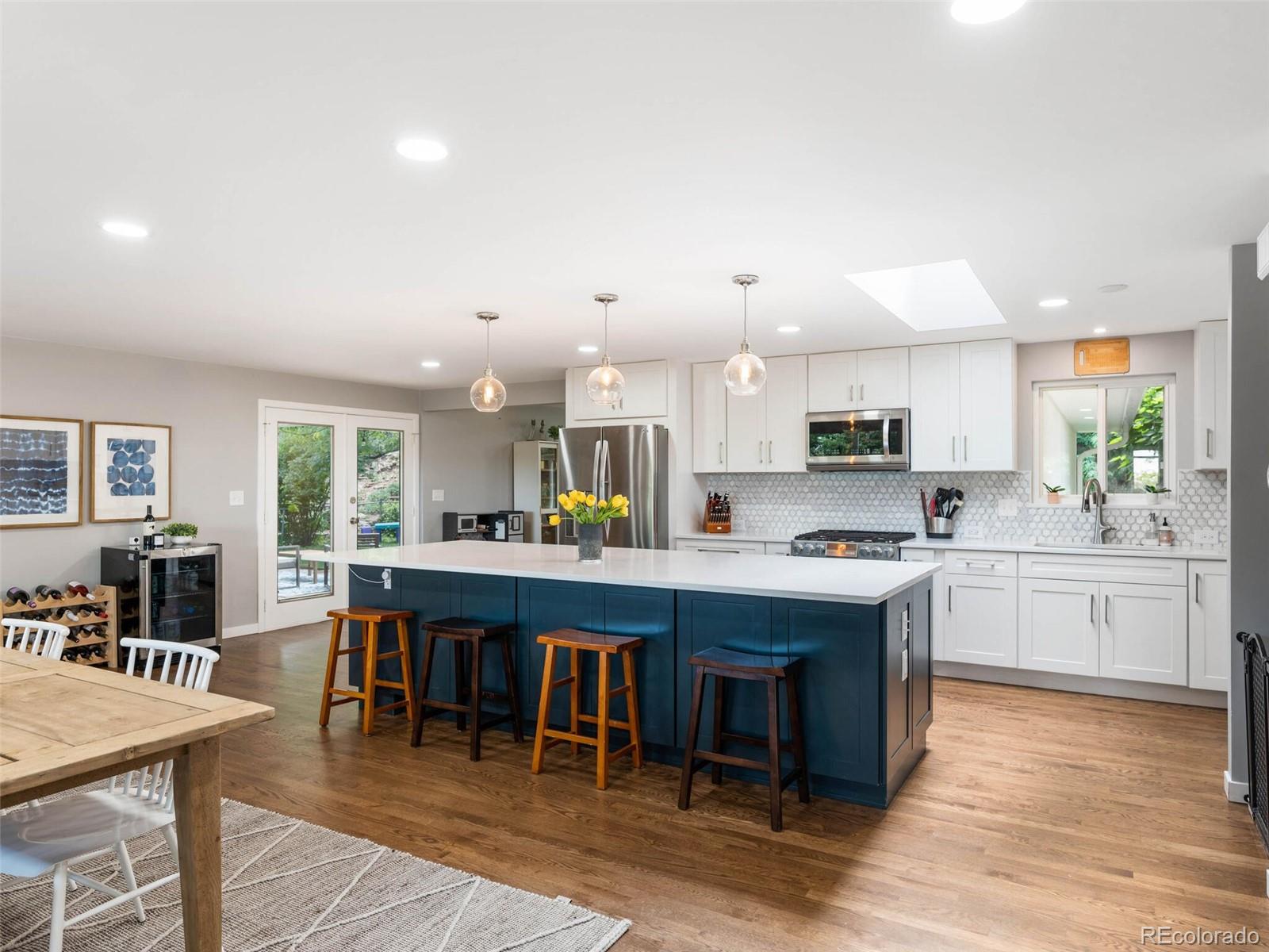 1826 Smith Road Golden, CO 80401 - Photo 4 of 35 a large kitchen with cabinets table and chairs