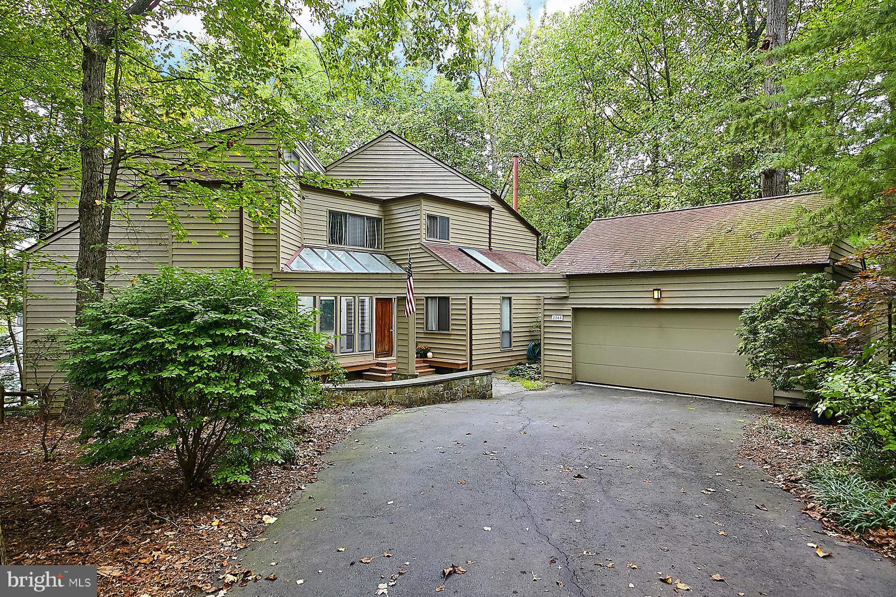 2265 Compass Point Lane Reston, VA 20191 - Photo 1 of 30 a view of a house with a yard and large tree