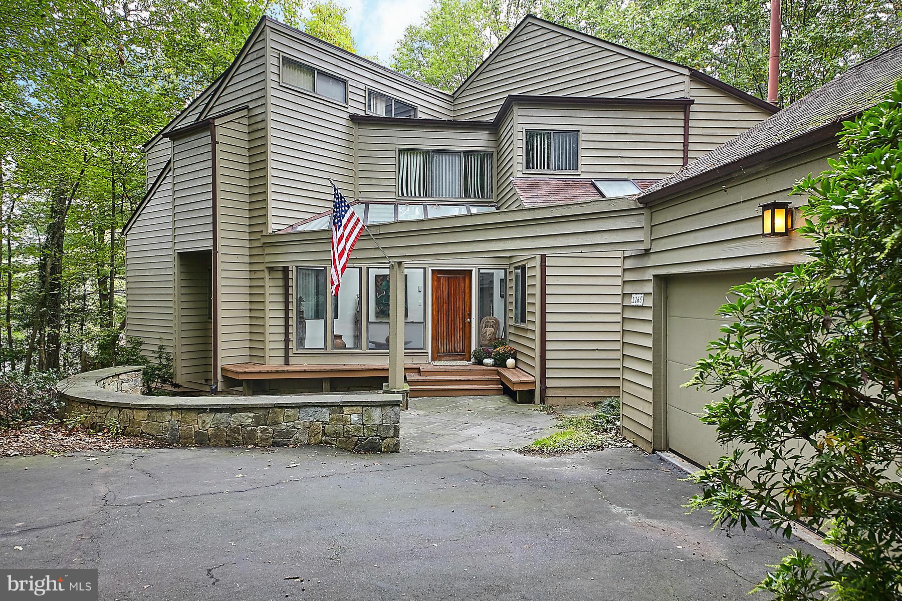 2265 Compass Point Lane Reston, VA 20191 - Photo 2 of 30 a front view of a house with garden