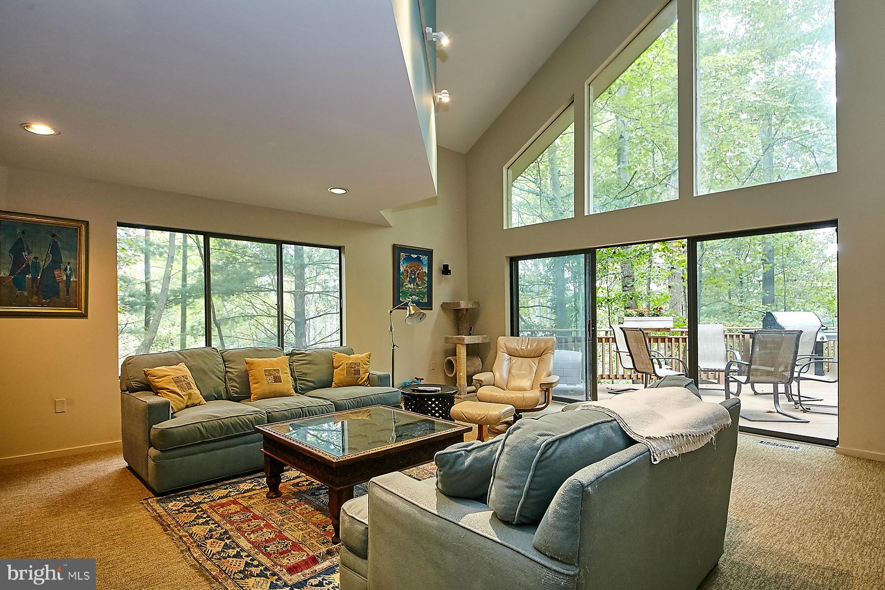2265 Compass Point Lane Reston, VA 20191 - Photo 11 of 30 a living room with furniture and a floor to ceiling window