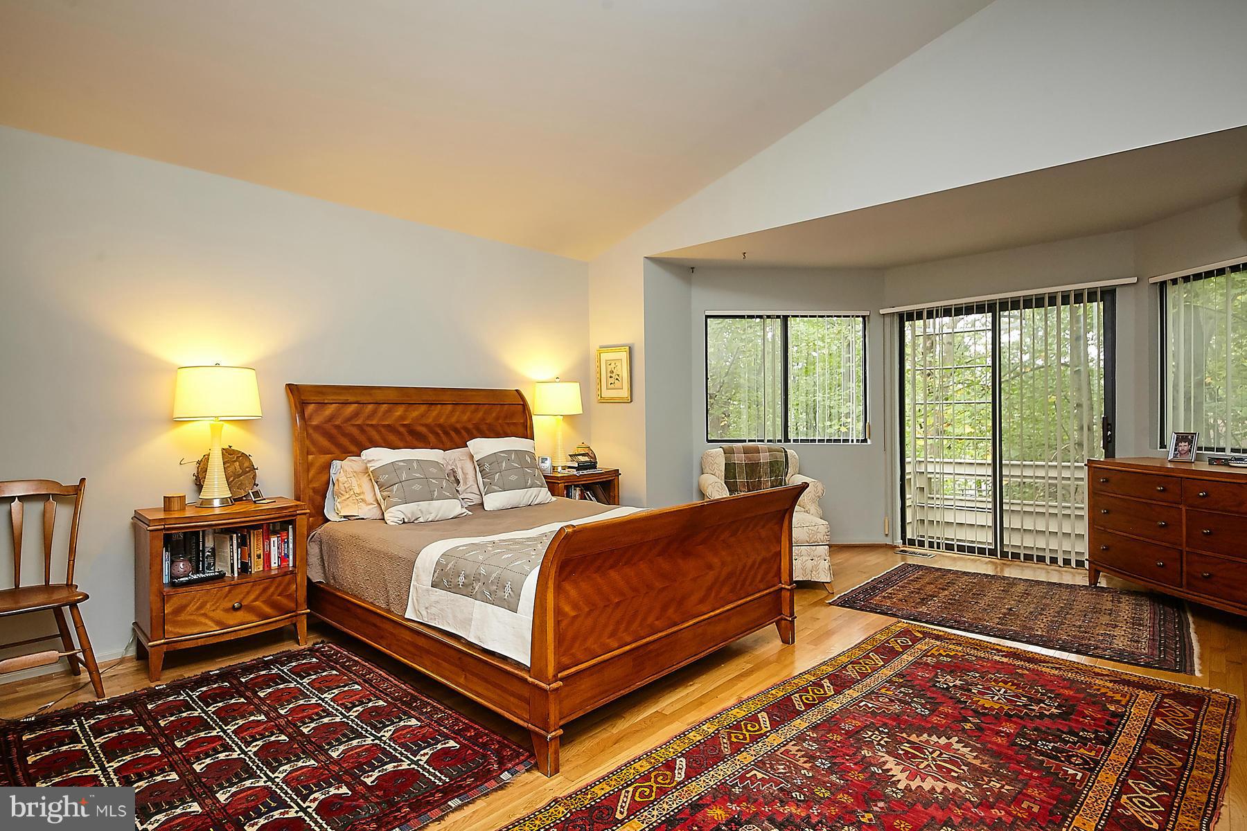 2265 Compass Point Lane Reston, VA 20191 - Photo 14 of 30 a bedroom with a bed and wooden floor