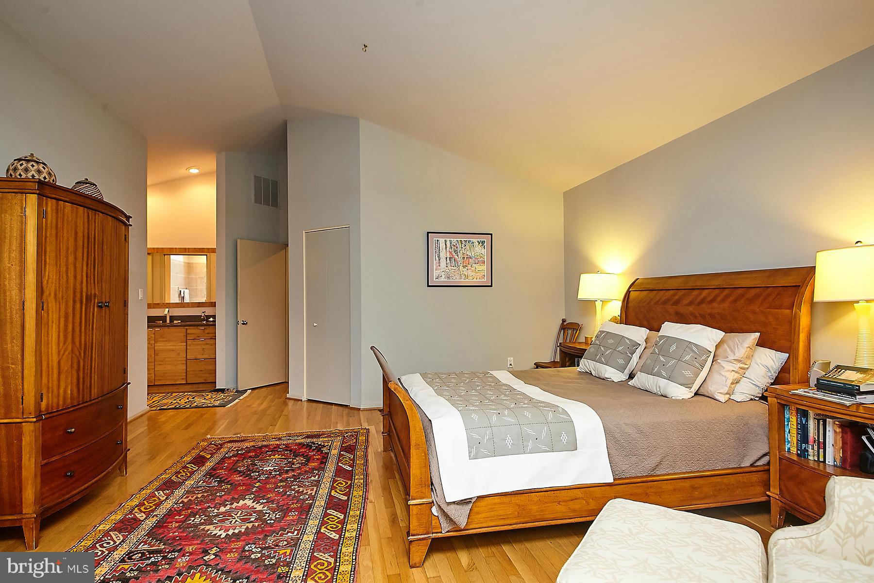2265 Compass Point Lane Reston, VA 20191 - Photo 15 of 30 a bedroom with a bed and wooden floor