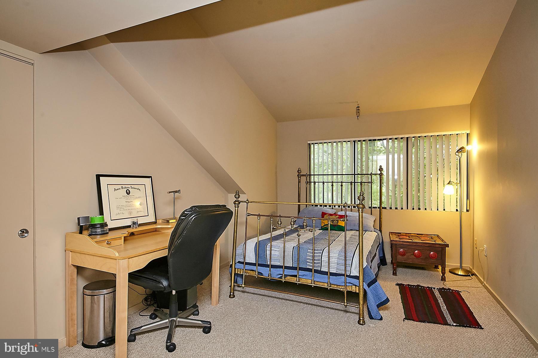 2265 Compass Point Lane Reston, VA 20191 - Photo 23 of 30 a bedroom with a bed and a workspace