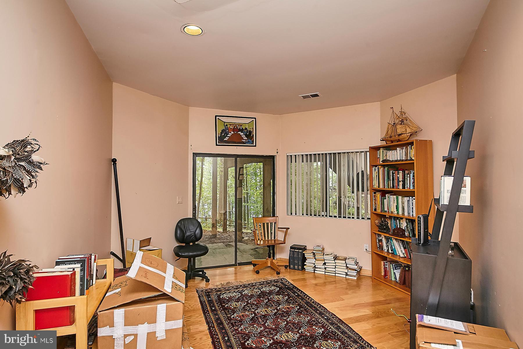 2265 Compass Point Lane Reston, VA 20191 - Photo 25 of 30 a living room with furniture a rug and a window
