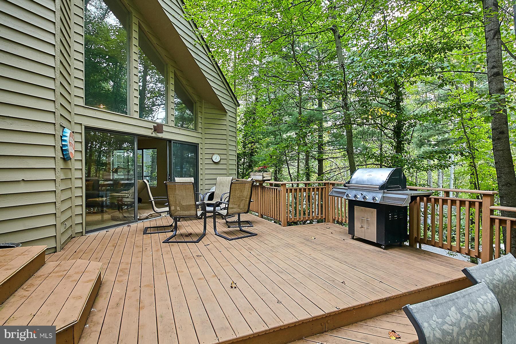 2265 Compass Point Lane Reston, VA 20191 - Photo 28 of 30 a view of a patio with a table and chairs