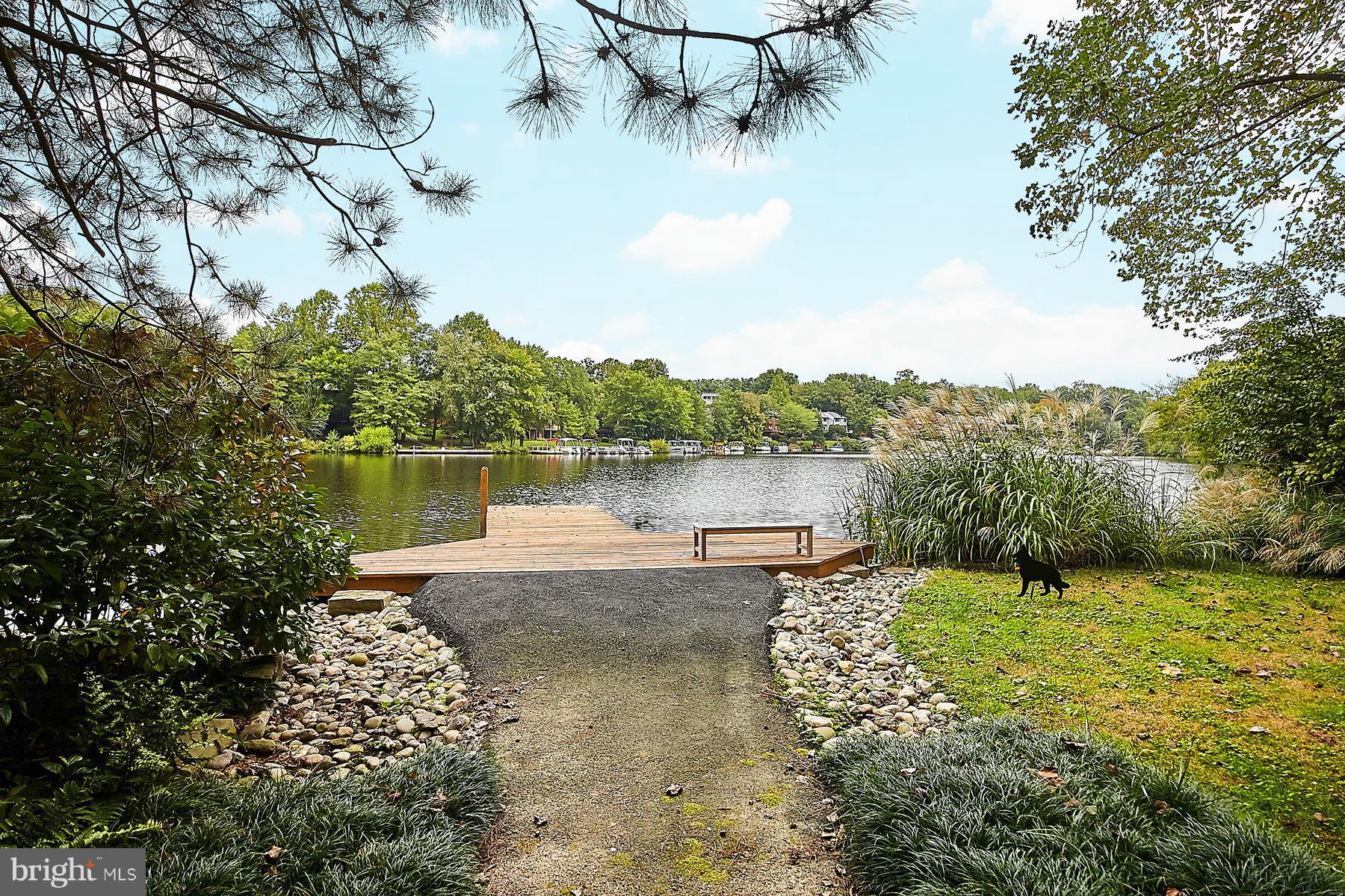 2265 Compass Point Lane Reston, VA 20191 - Photo 29 of 30 a view of a lake with a big yard and potted plants