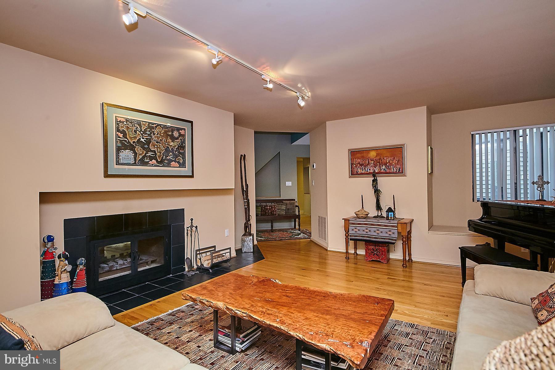 2265 Compass Point Lane Reston, VA 20191 - Photo 7 of 30 a living room with furniture and a fireplace