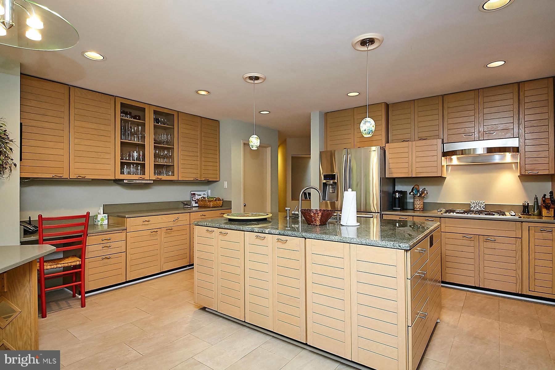 2265 Compass Point Lane Reston, VA 20191 - Photo 9 of 30 a kitchen with stainless steel appliances granite countertop a sink and cabinets