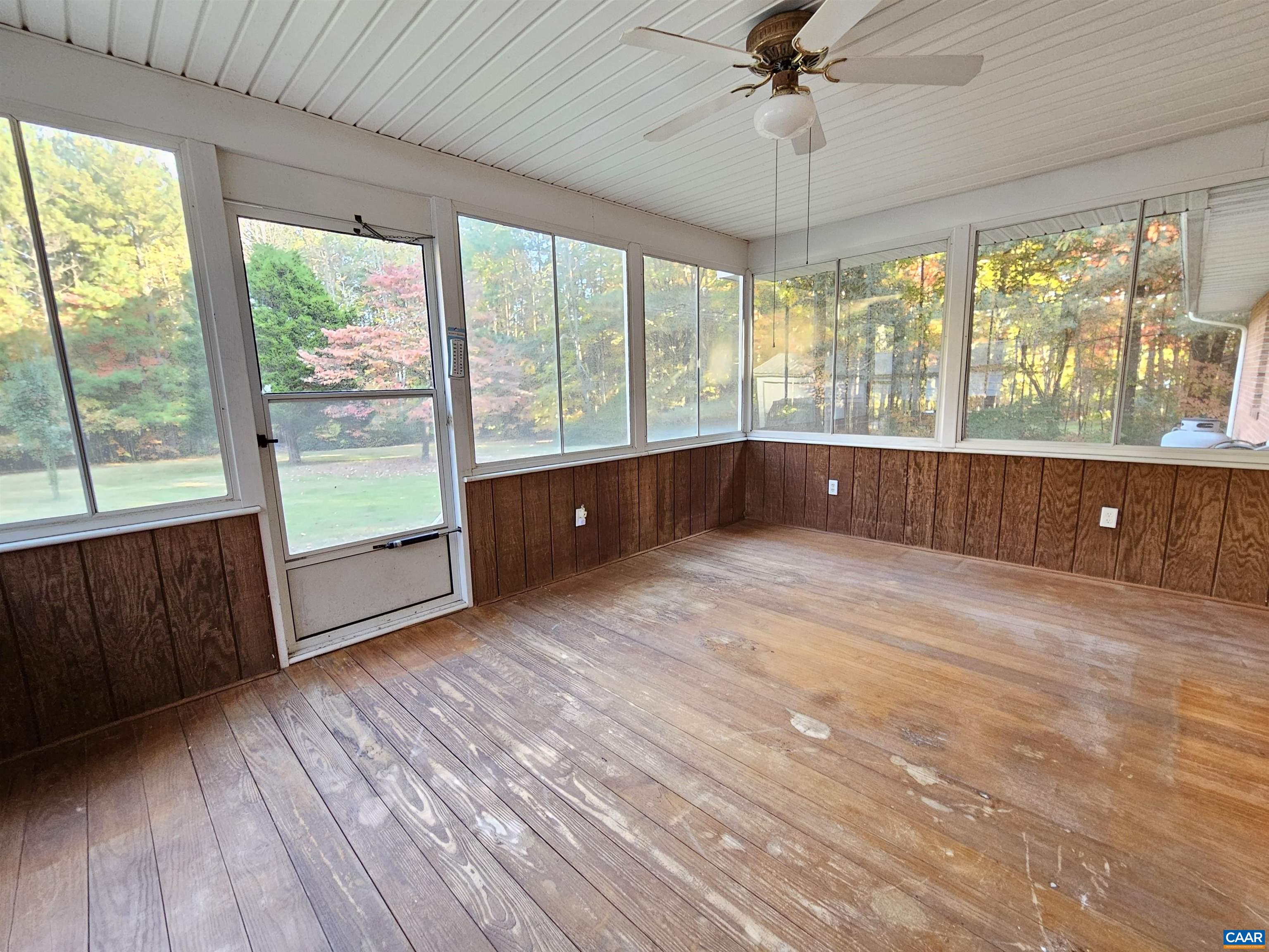226 Fanny White Road Buckingham, VA 23921 - Photo 12 of 29 a view of an empty room with a window and wooden floor