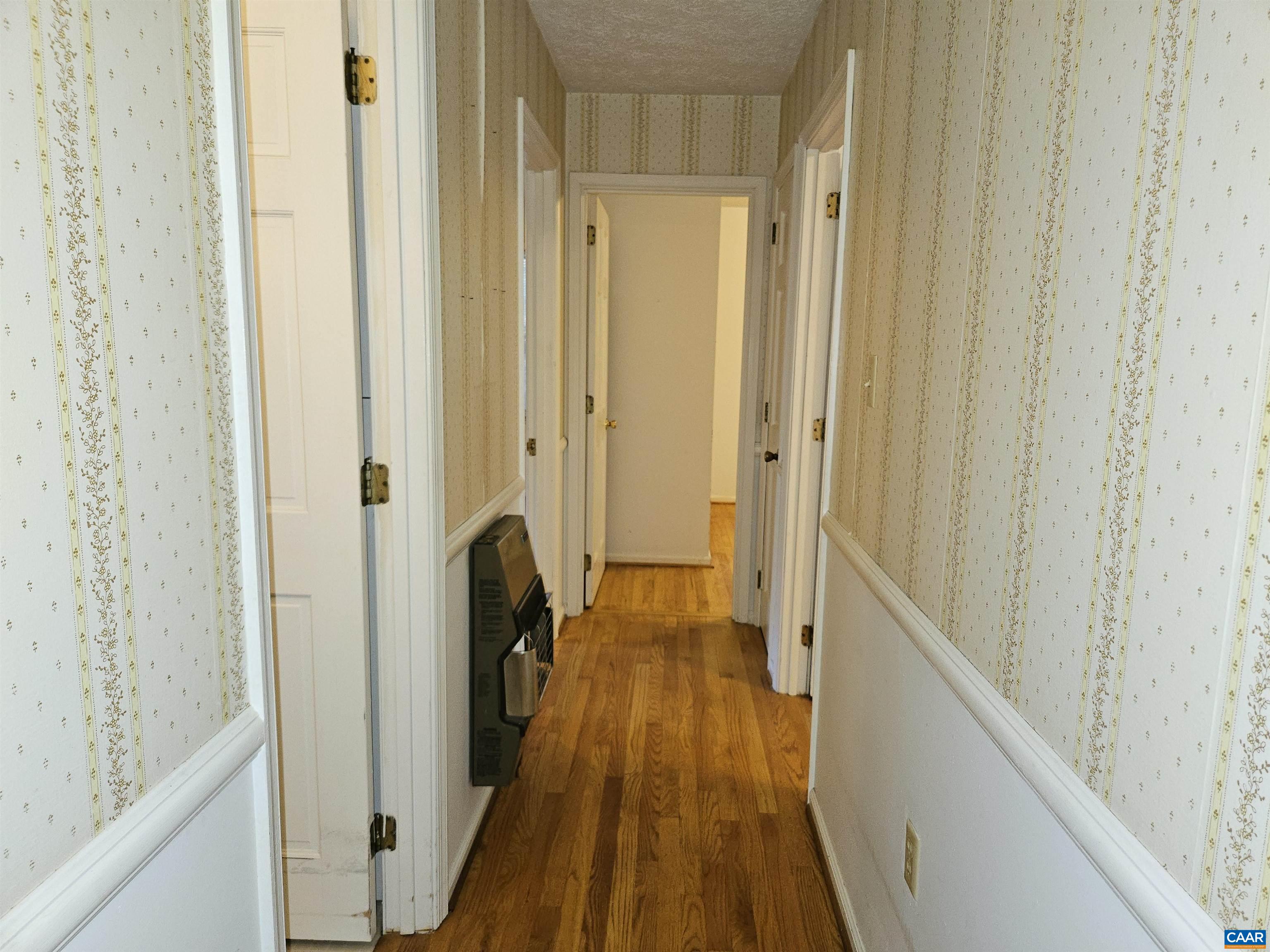 226 Fanny White Road Buckingham, VA 23921 - Photo 13 of 29 a view of a hallway with wooden floor and staircase