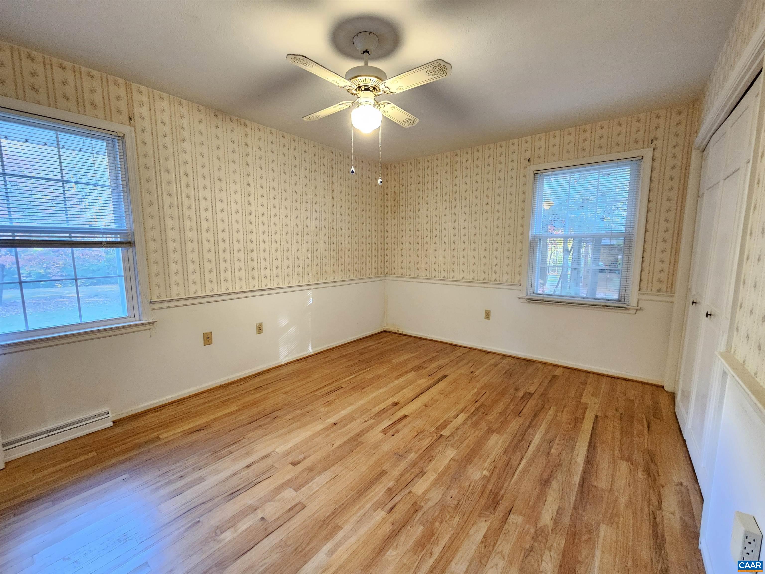 226 Fanny White Road Buckingham, VA 23921 - Photo 14 of 29 wooden floor in an empty room with a window