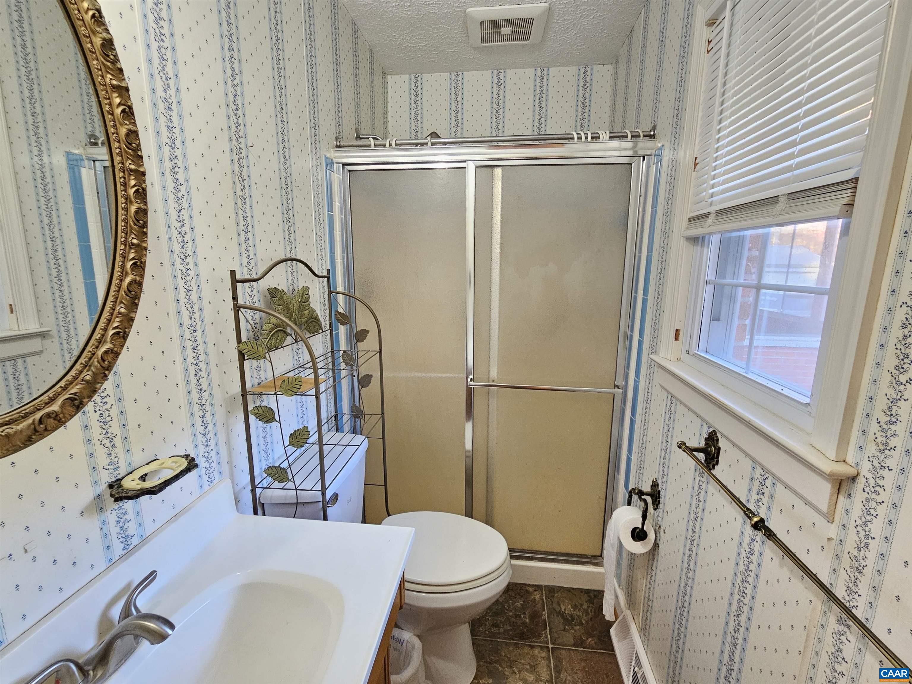 226 Fanny White Road Buckingham, VA 23921 - Photo 17 of 29 a bathroom with a sink toilet and shower