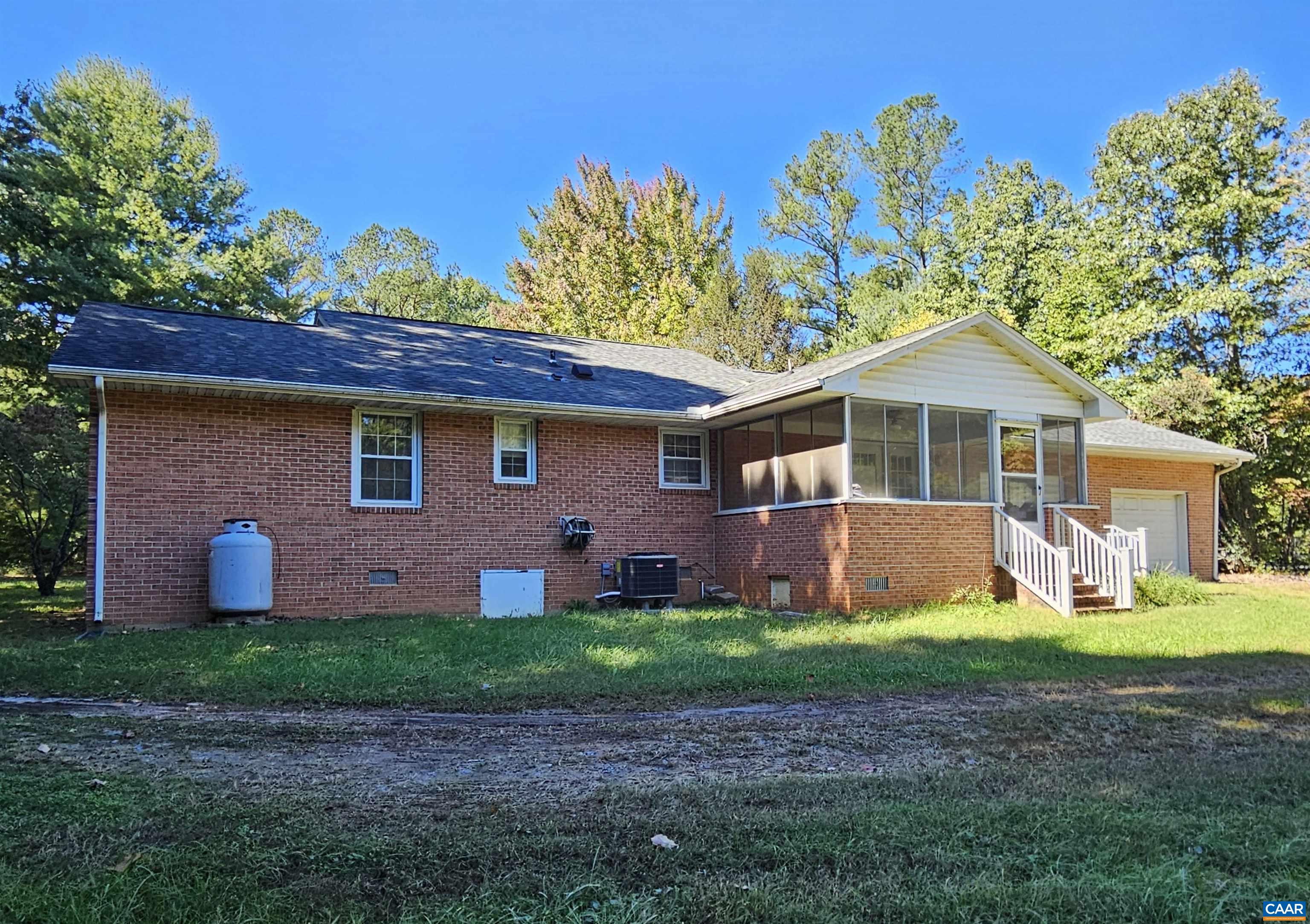 226 Fanny White Road Buckingham, VA 23921 - Photo 22 of 29 a front view of a house with a yard and garage