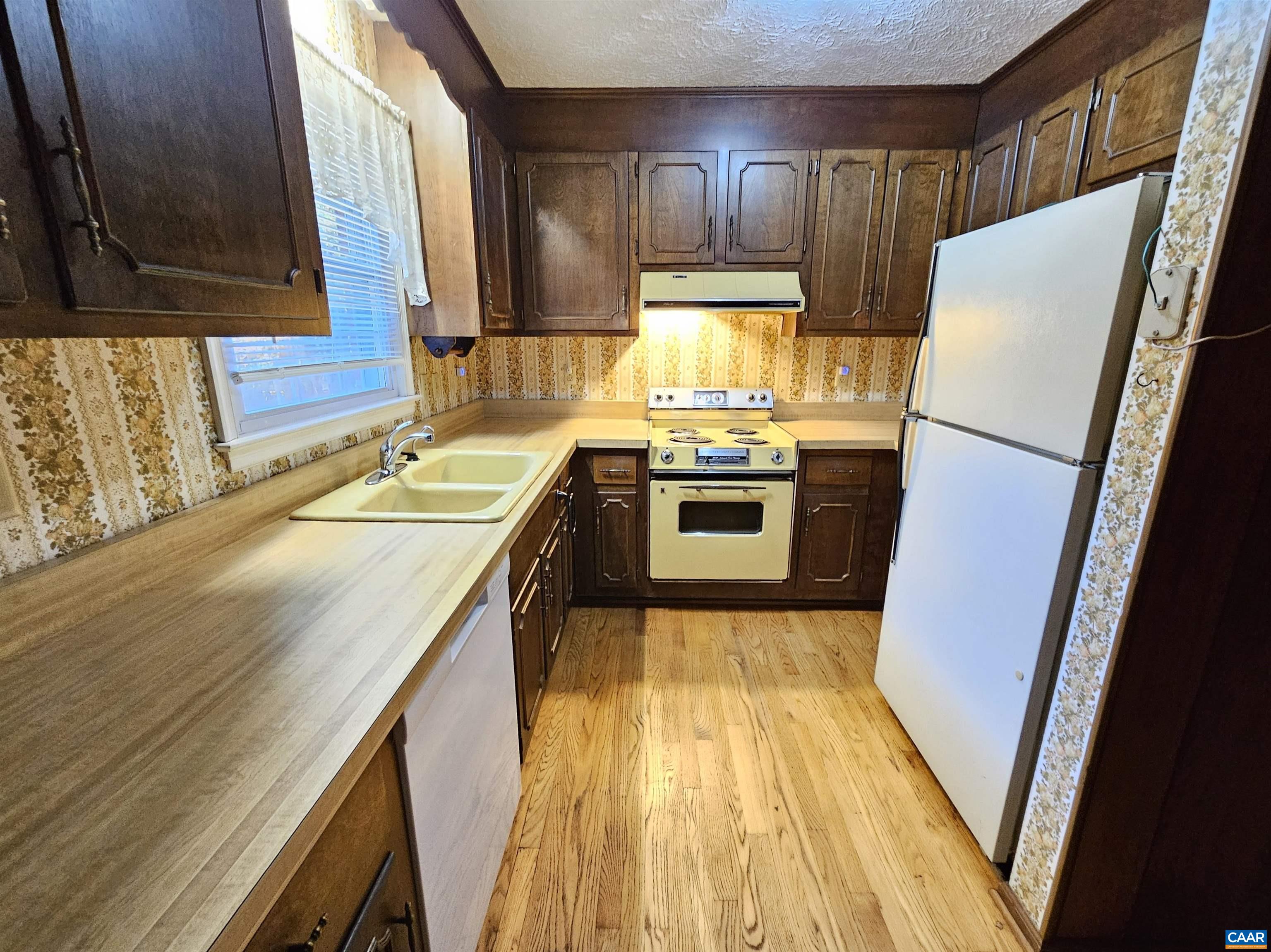 226 Fanny White Road Buckingham, VA 23921 - Photo 9 of 29 a kitchen with a refrigerator a sink and a stove